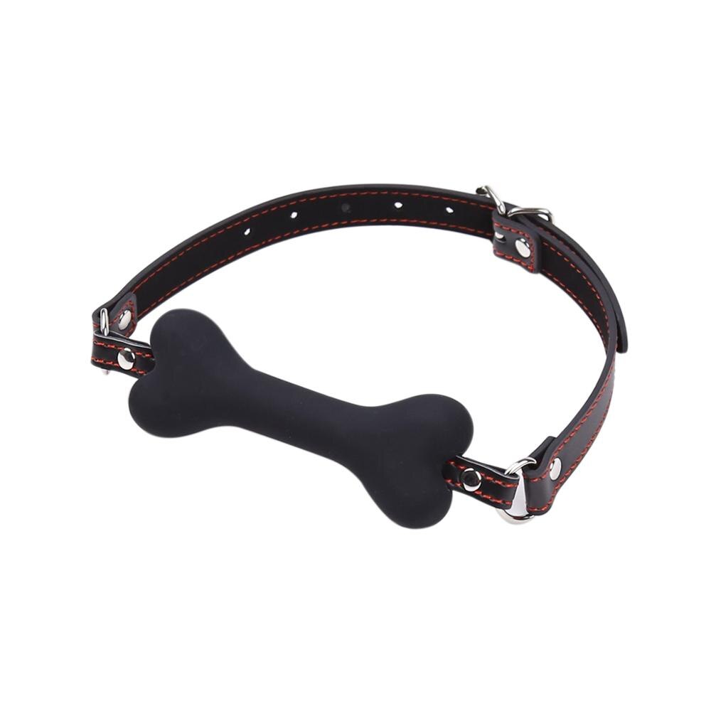 "Gagged by Obedience" – Ball Gag with Bone
No silly ball. You chew this bone while remaining blissfully muted. A constant reminder: your noise is a privilege, not a right.