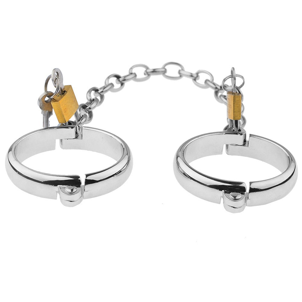 “Steel Submission Shackles” – Solid steel handcuffs. Cold and unyielding—just how your purpose should be.