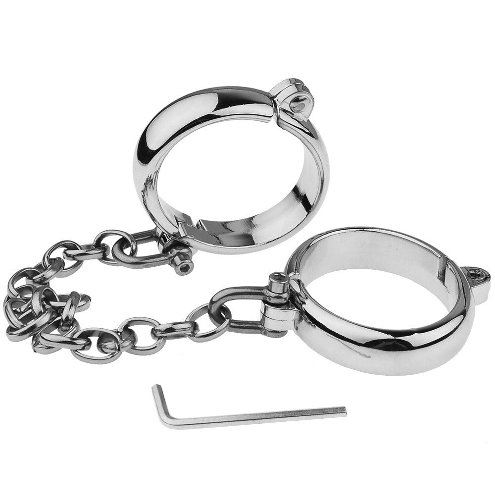 “Steel Submission Shackles” – Solid steel handcuffs. Cold and unyielding—just how your purpose should be.