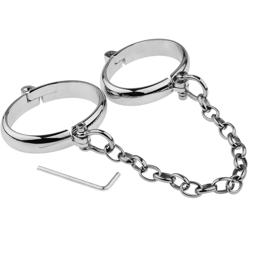 “Steel Submission Shackles” – Solid steel handcuffs. Cold and unyielding—just how your purpose should be.