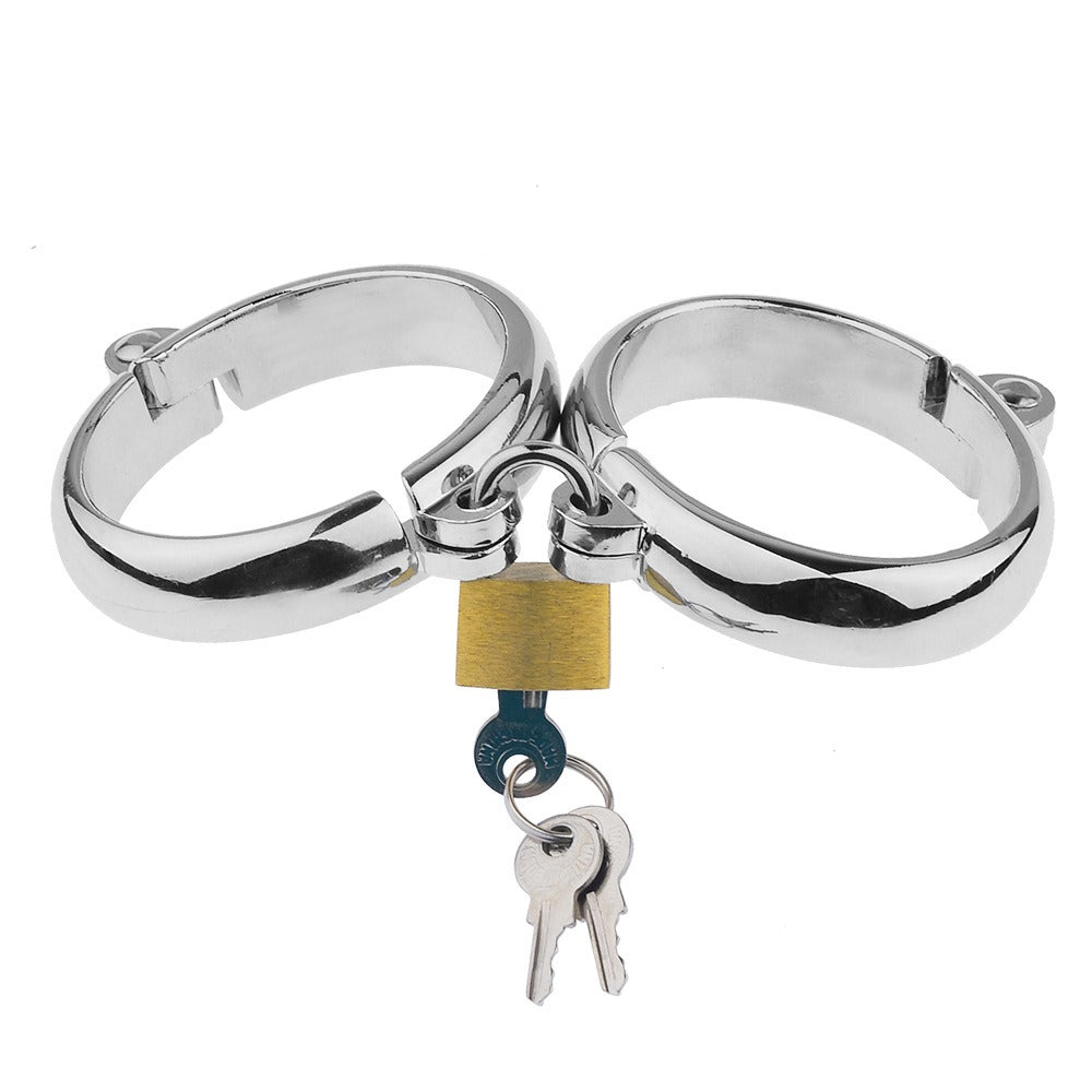 “Steel Submission Shackles” – Solid steel handcuffs. Cold and unyielding—just how your purpose should be.