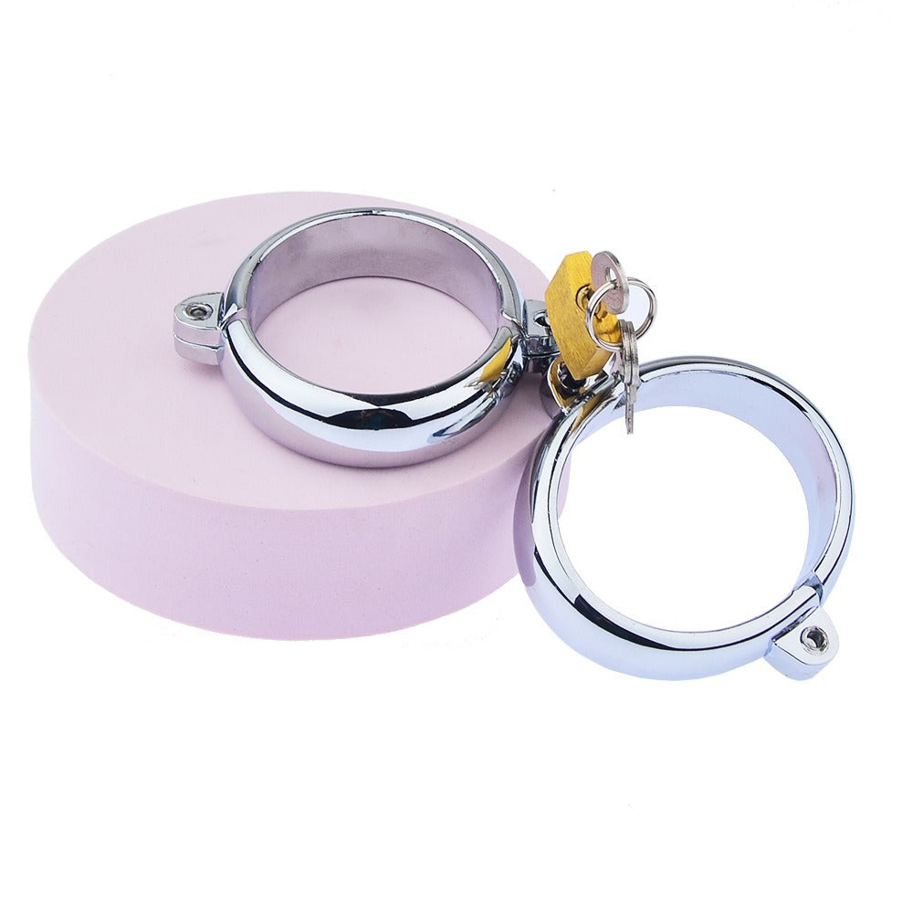 “Steel Submission Shackles” – Solid steel handcuffs. Cold and unyielding—just how your purpose should be.