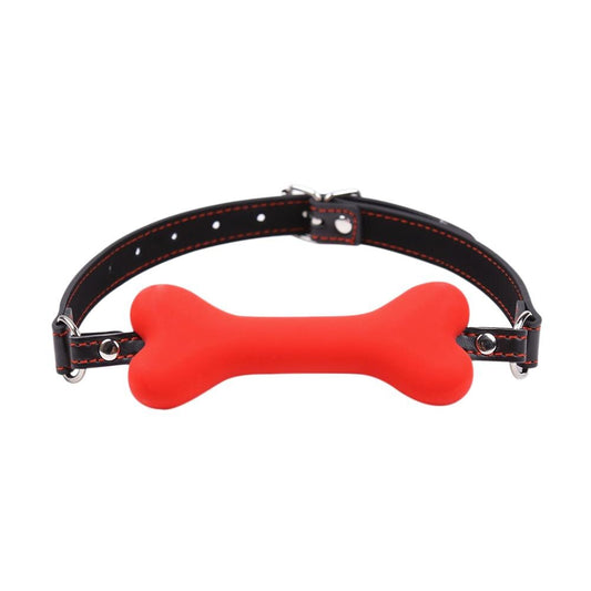 "Gagged by Obedience" – Ball Gag with Bone
No silly ball. You chew this bone while remaining blissfully muted. A constant reminder: your noise is a privilege, not a right.